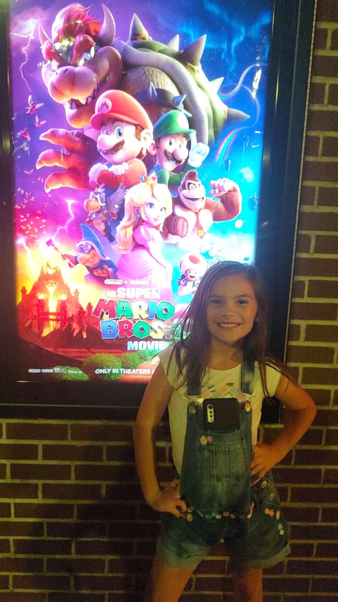 Laylah is registered to the contest to win money with this photo: art, artist, belt, display_device, electronic_signage, entertainment, event, fun, happy, illustration, joy, led_backlit_lcd_display, light, magenta, neon, painting, person, pink, signage, smile