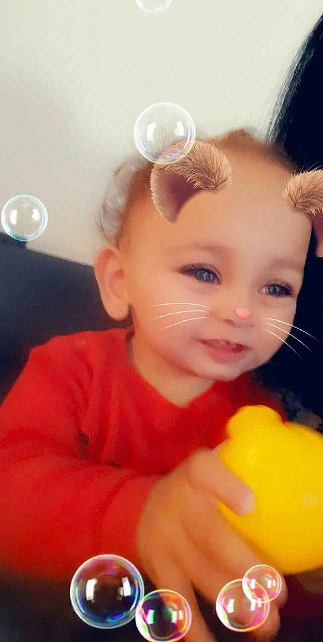 Liam participe au concours pour gagner de l'argent avec cette photo : baby, baby_playing_with_toys, baby_toddler_clothing, cheek, chin, dress, ear, eyelash, finger, fun, hairstyle, happy, iris, lip, mouth, nose, orange, person, skin, smile