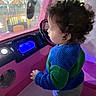 Adam joined the competition — help win amazing prizes! blue, child, clothing, curly_hair, cute, dashboard, face, green, hand, indoor, lights, pink, play_area, portrait, profile_view, steering_wheel, sweater, toddler, toy_car, young_child