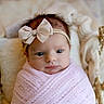 Kiana is registered to the contest to win money with this photo: newborn, baby, infant, wrapped, pink_blanket, headband, bow, basket, woven, cozy, blanket, sleepy, cute, portrait, indoors, soft_texture, closeup, face, child, resting