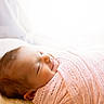 Kiana joined the competition — help win amazing prizes! baby, newborn, sleeping, smiling, pink_blanket, knitted, cozy, soft_light, peaceful, infant, wrapped, portrait, cute, head, face, sleep, child, indoors, closeup, toddler