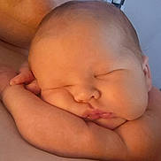 Hugo is registered to the contest to win money with this photo: baby, sleeping, close_up, arm, face, peaceful, skin, infant, newborn, resting, cute, child, portrait, soft_light, indoors, peace, calm, head, expression, human