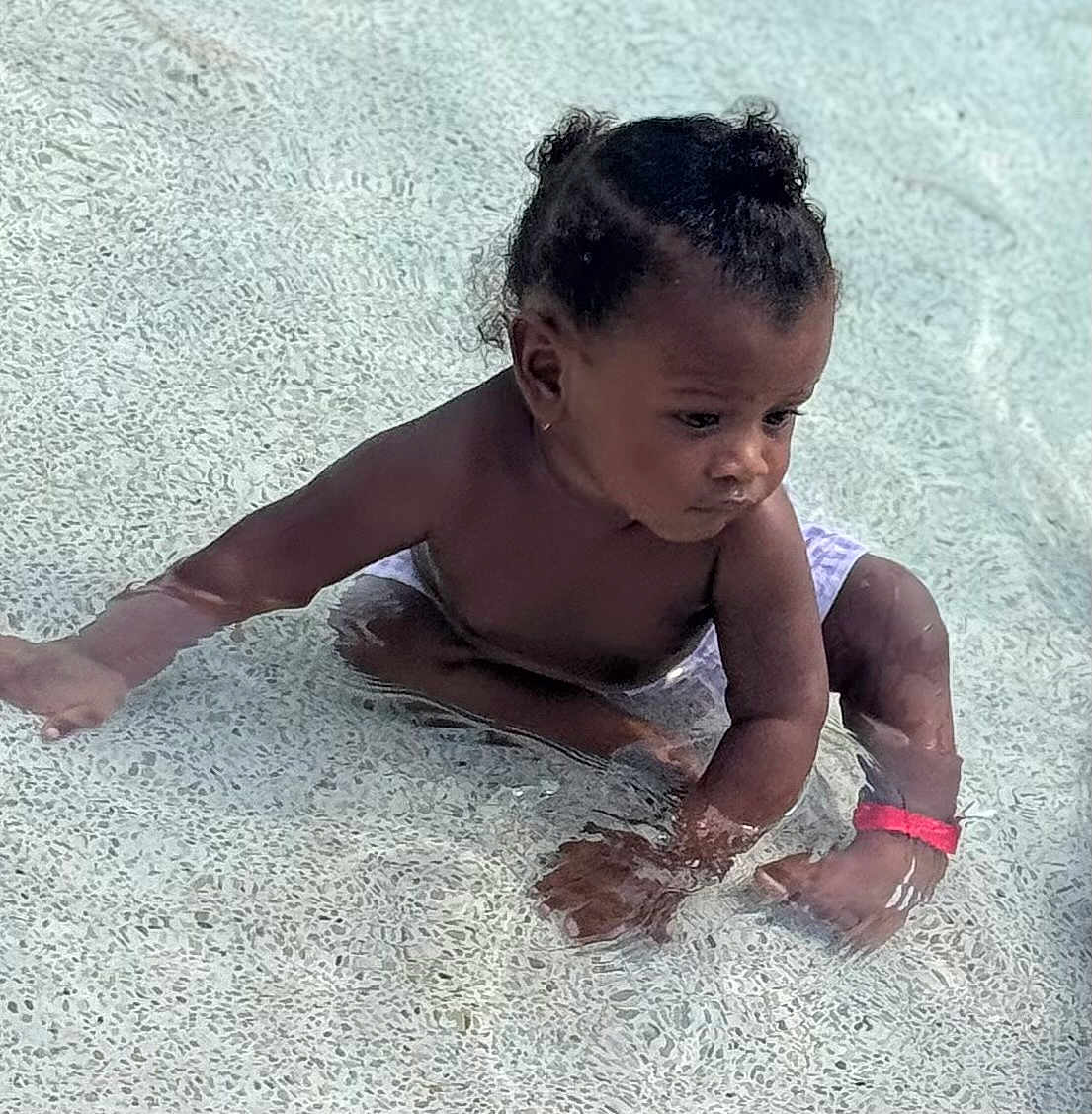 Amun-Ra joined the competition — help win amazing prizes! toddler, child, water, pool, sitting, curly_hair, pigtails, wristband, diaper, skin, outdoor, play, exploration, summer, shallow_water, cute, young_child, baby, person, swimming