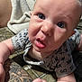 Aiden joined the competition — help win amazing prizes! baby, infant, closeup, tattoo, hand, face, blue_eyes, curious, expression, clothing, blanket, skin, person, cute, indoors, young_child, toddler, sleeve, texture, portrait