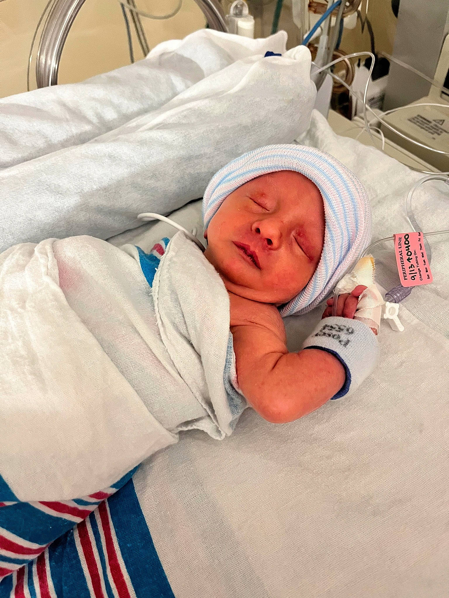 James is registered to the contest to win money with this photo: baby, baby_sleeping, baby_toddler_clothing, bed, bedding, bedtime, child, comfort, event, headwear, hospital, hospital_bed, linens, medical, medical_equipment, nap, person, room, service, stethoscope