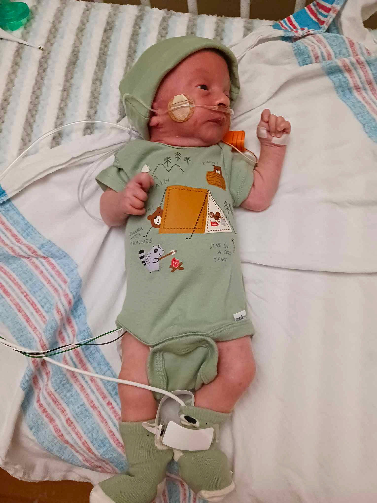 James joined the competition — help win amazing prizes! baby, baby_products, baby_safety, baby_sleeping, baby_toddler_clothing, child, comfort, green, hat, hospital, linens, medical, pattern, peach, person, pink, room, sleeve, t_shirt, textile