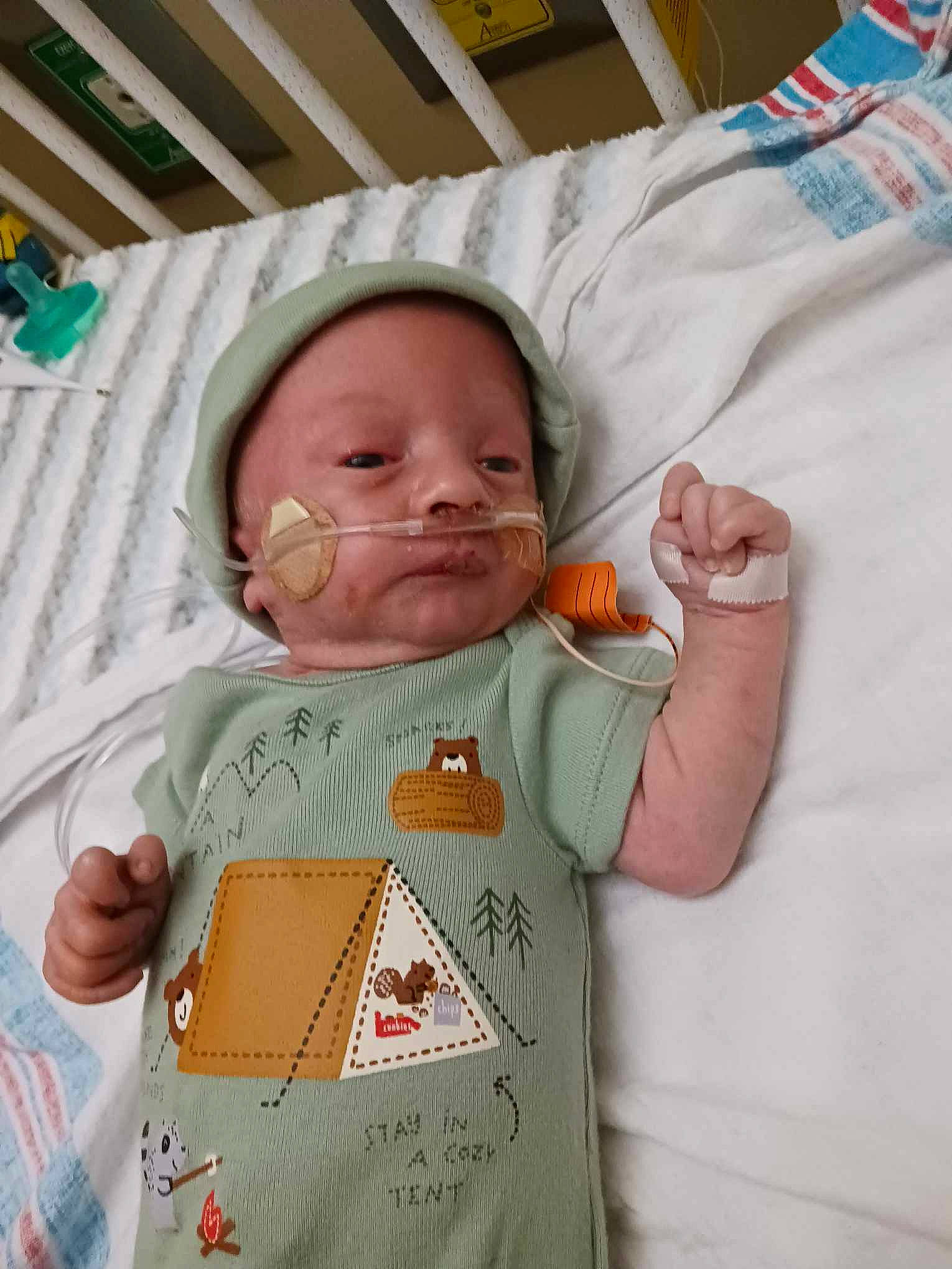 James is registered to the contest to win money with this photo: baby, baby_products, baby_safety, baby_sleeping, baby_toddler_clothing, cheek, child, comfort, eye, face, head, linens, mouth, nose, person, room, skin, sleeve, smile, t_shirt