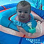 baby, blue, child, cute, float, fun, hand, infant, outdoor, person, pink, plastic, play, pool, ripple, summer, swim_ring, swimming, toy, water