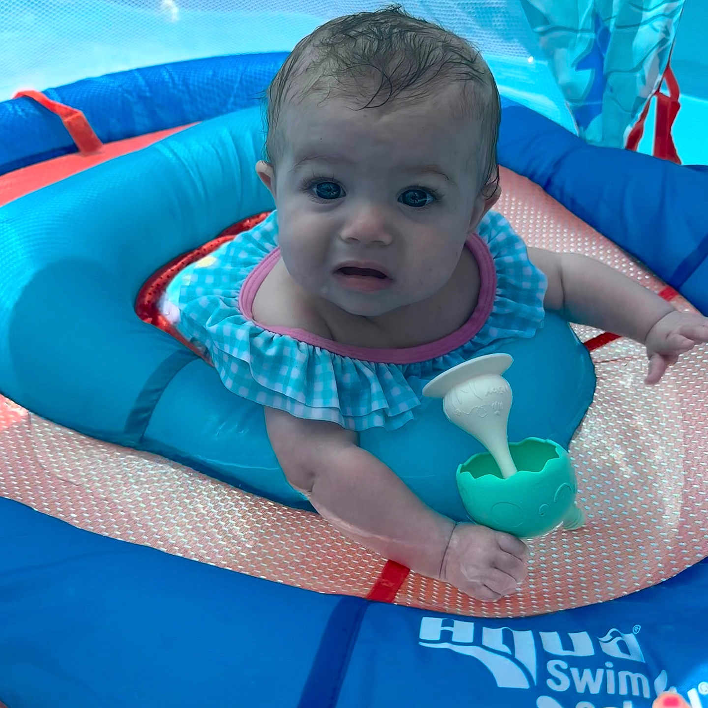 Noelle joined the competition — help win amazing prizes! baby, blue, child, cute, float, fun, hand, infant, outdoor, person, pink, plastic, play, pool, ripple, summer, swim_ring, swimming, toy, water