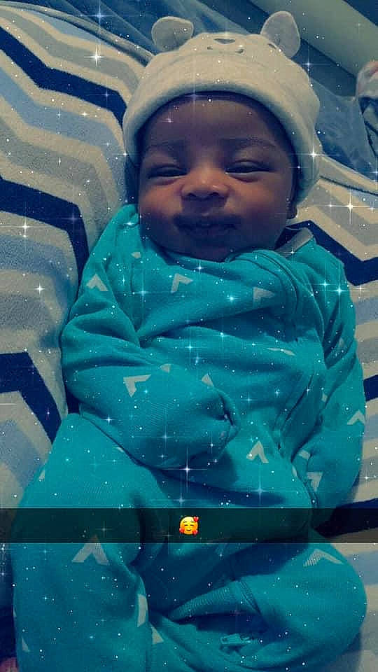 Deshawn is registered to the contest to win money with this photo: blue, child, headwear, person, smile