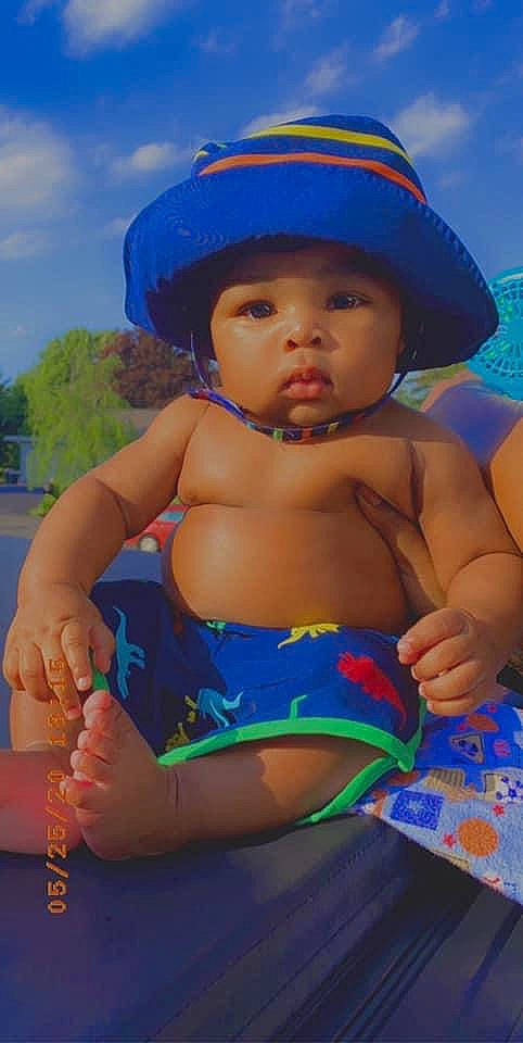 Deshawn joined the competition — help win amazing prizes! baby, child, fun, hat, headgear, headwear, leisure, person, play, smile, summer, sun_hat, swimwear, toddler, vacation