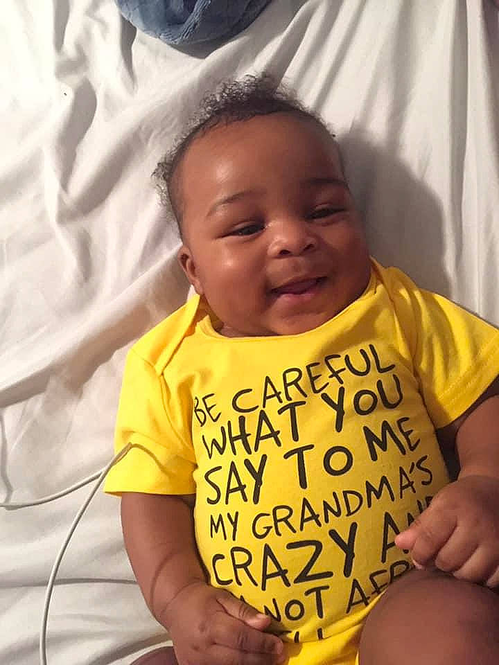Deshawn is registered to the contest to win money with this photo: baby, baby_toddler_clothing, cheek, child, face, forehead, happy, head, person, smile, t_shirt, toddler, yellow