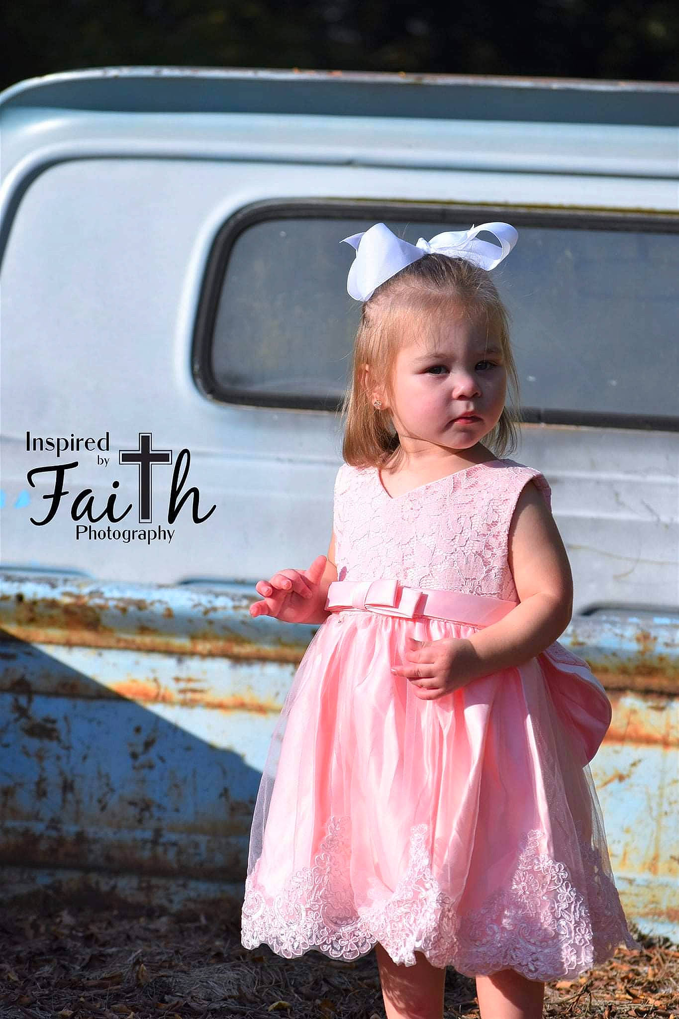 Tinsley is registered to the contest to win money with this photo: automotive_exterior, automotive_lighting, baby_toddler_clothing, blond, bumper, child, day_dress, dress, eye, face, flash_photography, grass, hair, happy, head, motor_vehicle, person, photograph, pink, toddler