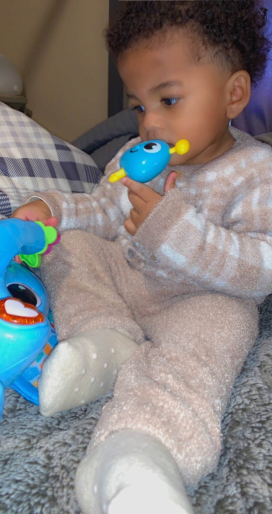 Isaias is registered to the contest to win money with this photo: baby, baby_playing_with_toys, baby_products, baby_toddler_clothing, baby_toys, blue, cheek, child, comfort, fun, happy, head, person, plastic, play, room, sitting, skin, stuffed_toy, toddler