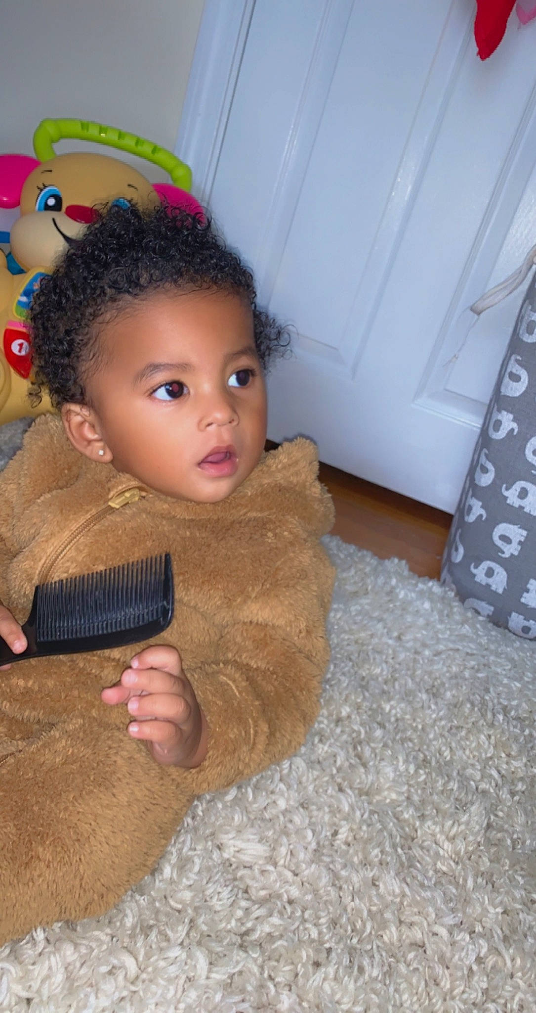 Isaias joined the competition — help win amazing prizes! black_hair, cheek, chin, door, ear, eye, eyebrow, eyelash, fawn, floor, flooring, gesture, hardwood, headgear, iris, neck, nose, person, skin, toy