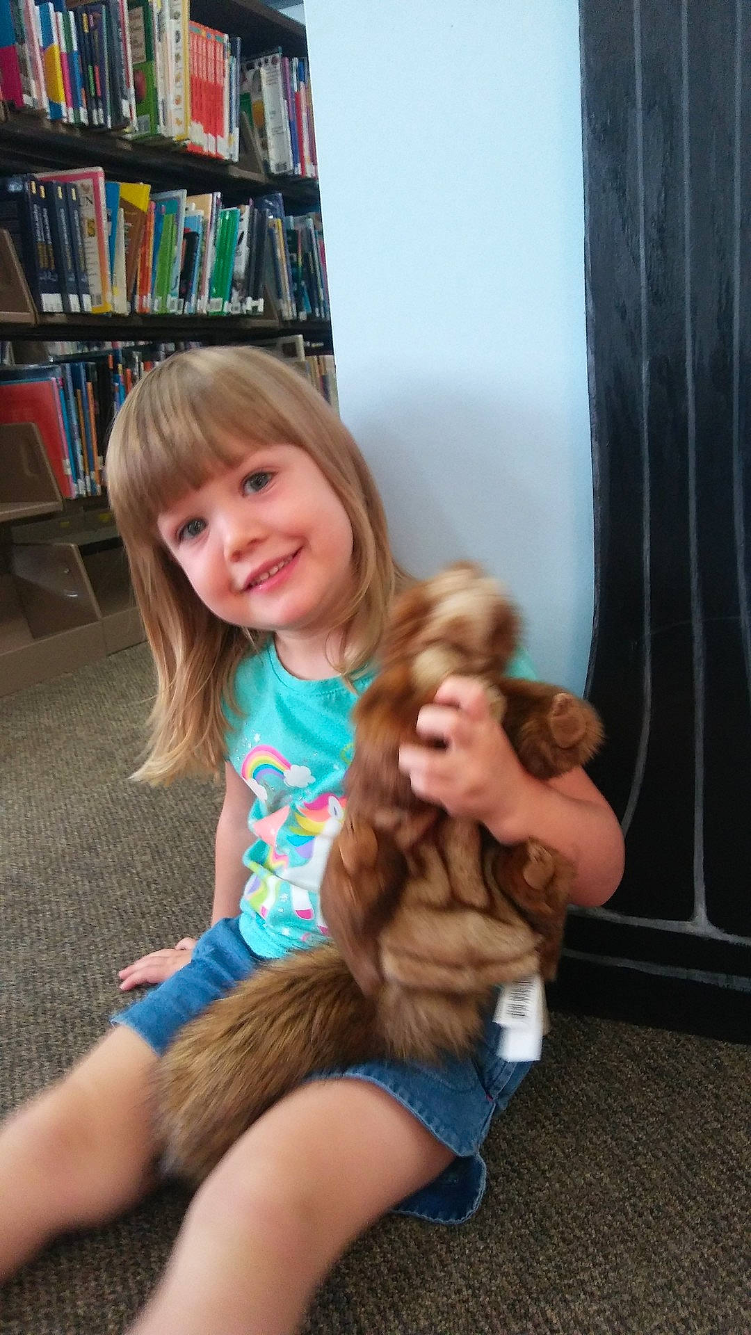 Baylee is registered to the contest to win money with this photo: blond, child, daughter, finger, flooring, fun, fur, girl, hair, hug, human_hair_color, joy, leg, mammal, organ, person, play, sitting, skin, snapshot