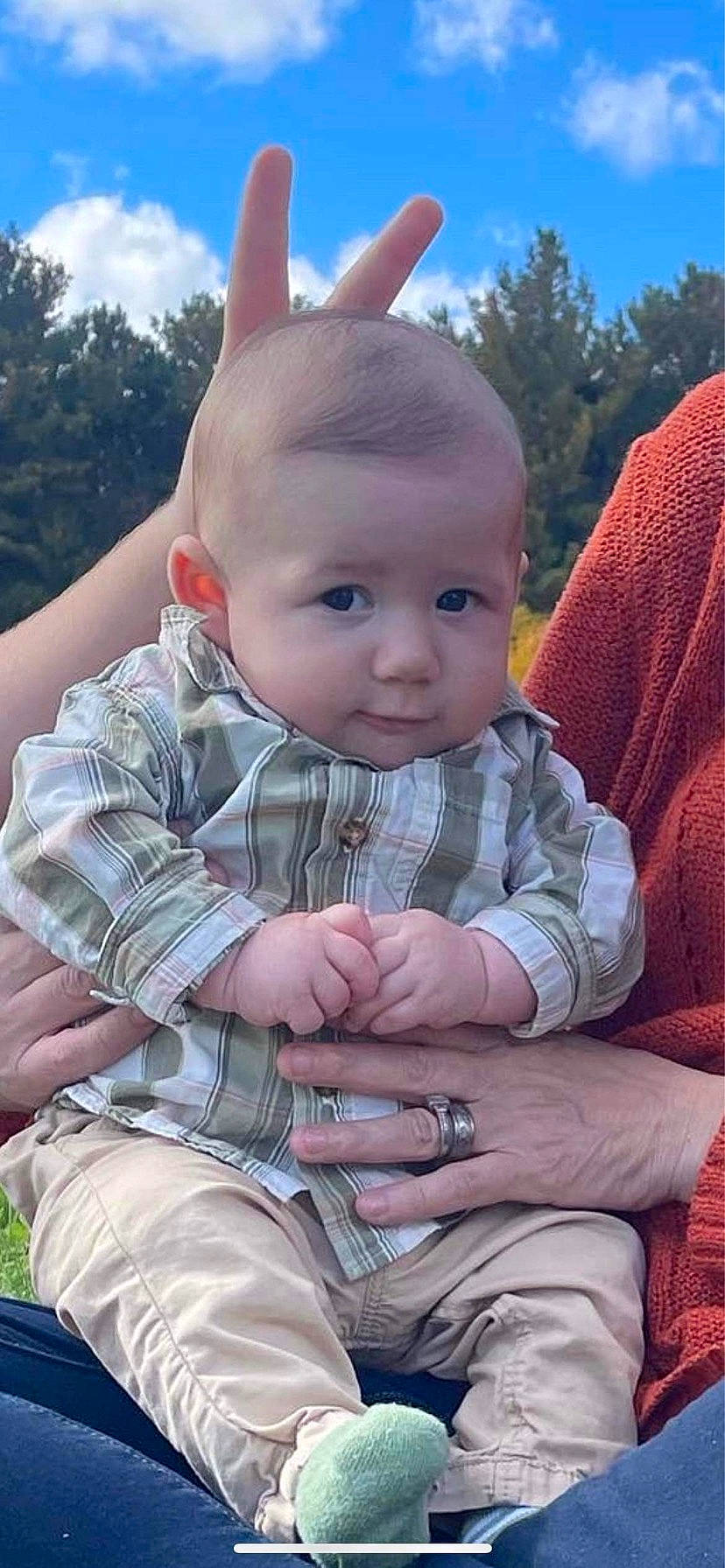 Declan is registered to the contest to win money with this photo: baby, baby_toddler_clothing, blue, cheek, child, cloud, cool, facial_expression, finger, gesture, grass, hairstyle, happy, human_body, nose, person, plant, skin, sky, toddler