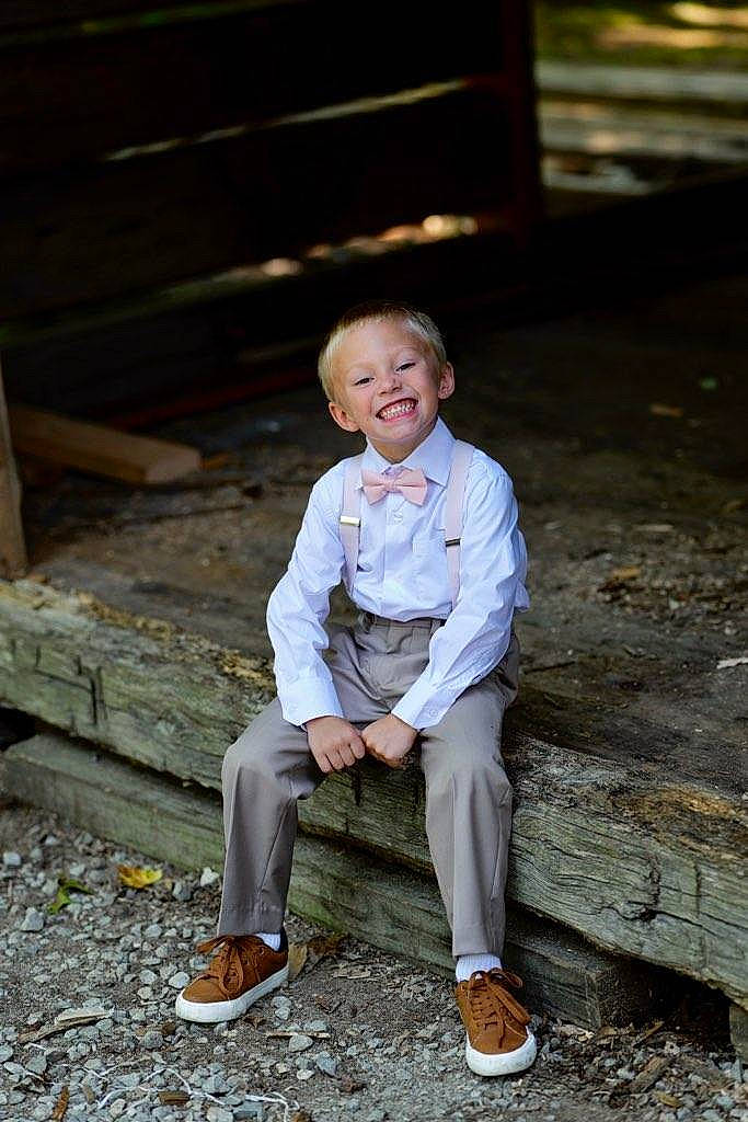 Landon is registered to the contest to win money with this photo: child, eye, flash_photography, formal_wear, fun, grass, hair, happy, head, joy, landscape, leisure, people_in_nature, person, portrait_photography, sitting, smile, soil, standing, toddler