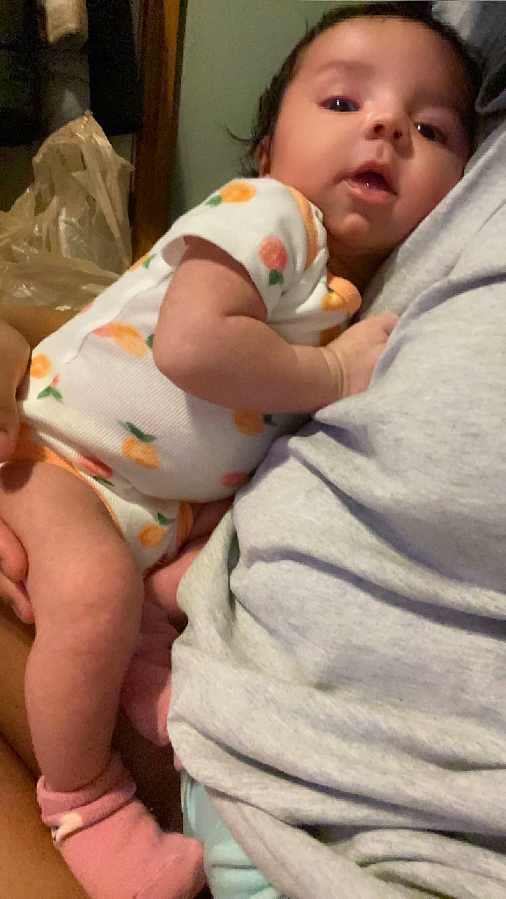 Kmora is registered to the contest to win money with this photo: abdomen, baby, baby_toddler_clothing, cheek, chest, comfort, elbow, eye, facial_expression, finger, happy, linens, mouth, nose, person, skin, stomach, thigh, thumb, toddler