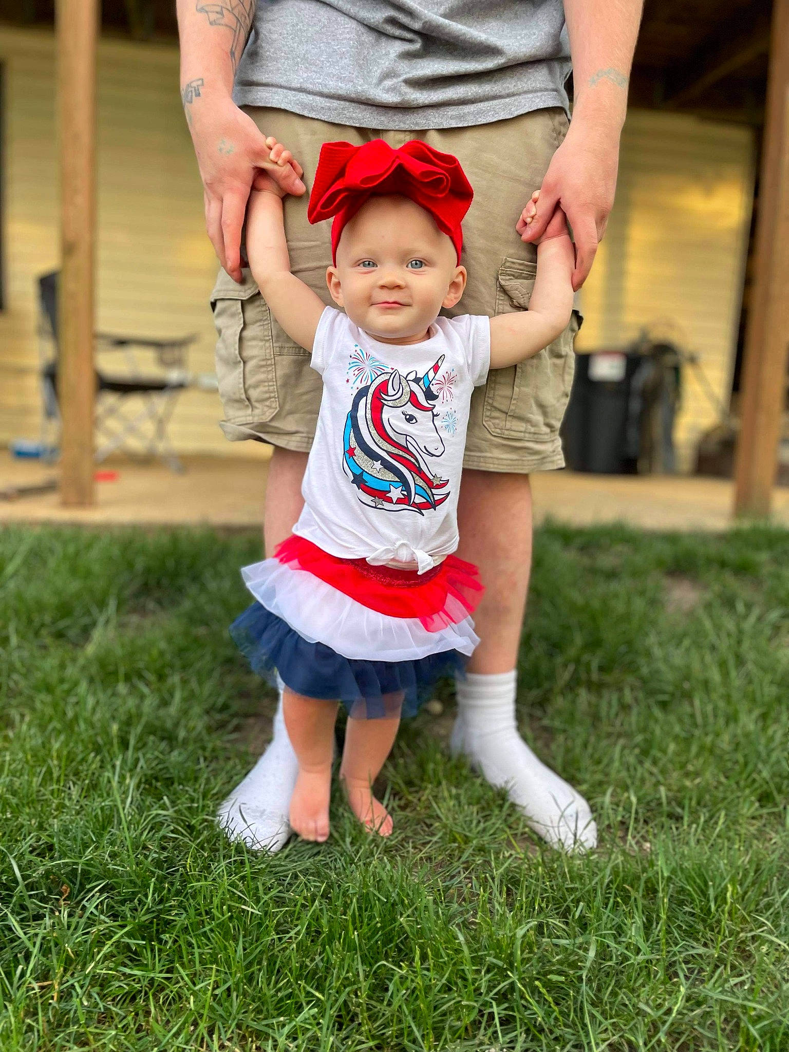 Ellieanna is registered to the contest to win money with this photo: barefoot, child, facial_expression, finger, fun, gesture, grass, hairstyle, happy, hat, joy, lawn, leg, leisure, people_in_nature, person, pink, plant, recreation, shorts