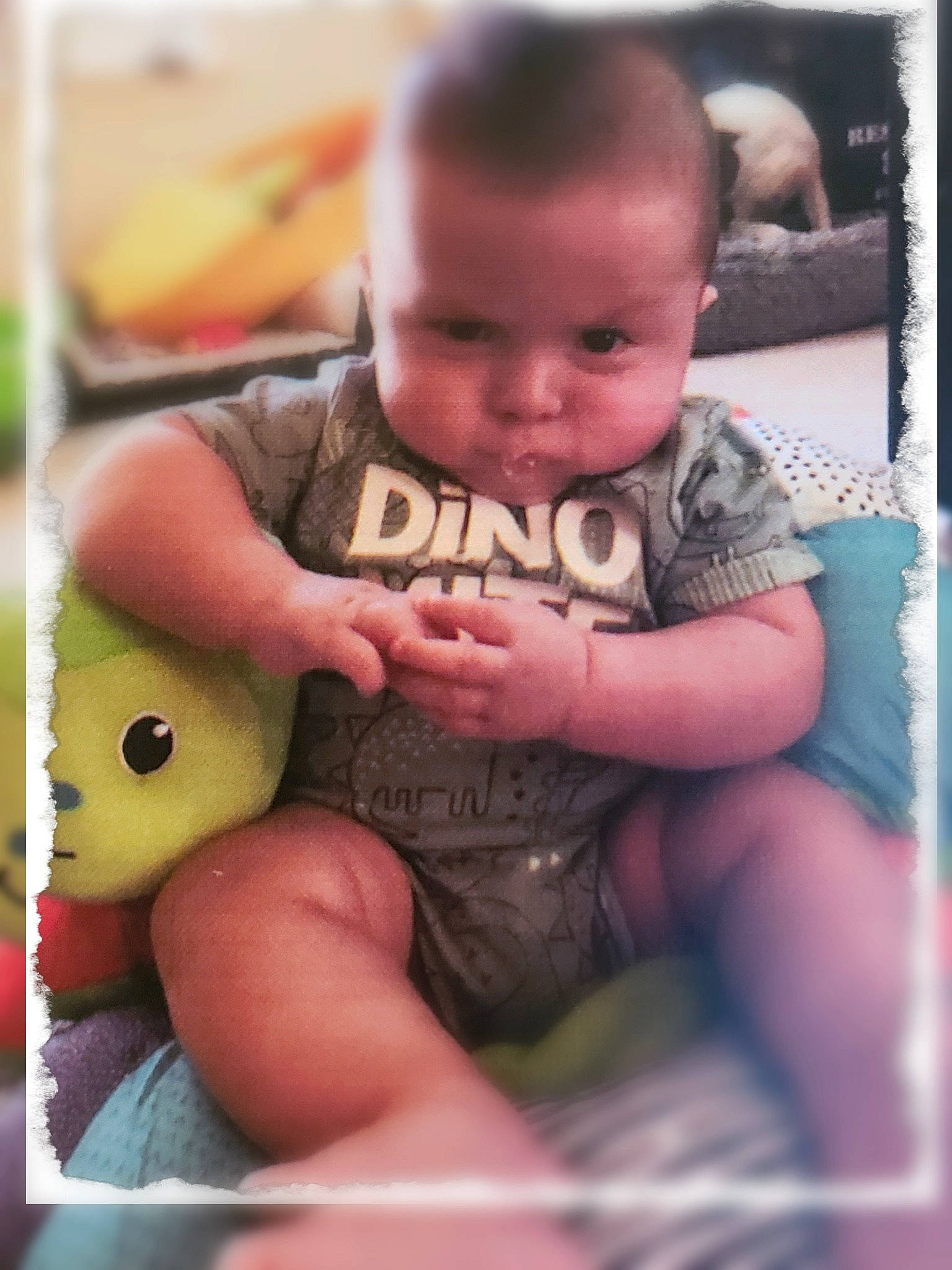 Coatney is registered to the contest to win money with this photo: baby, baby_toddler_clothing, cheek, child, finger, fun, grass, hand, happy, human_leg, lap, mouth, nose, person, pink, sitting, skin, thigh, thumb, toddler