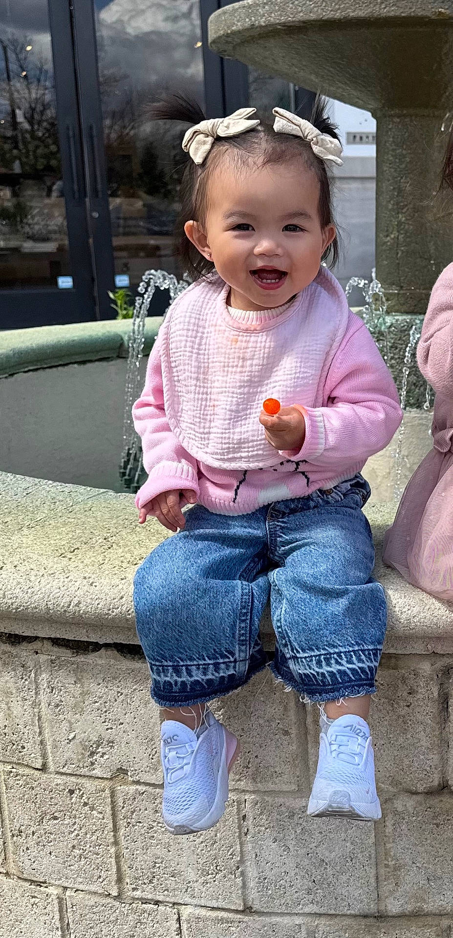 child, clothing, coat, face, female, footwear, girl, happy, head, jacket, jeans, pants, person, photography, plant, portrait, pottedplant, shoe, sitting, smile