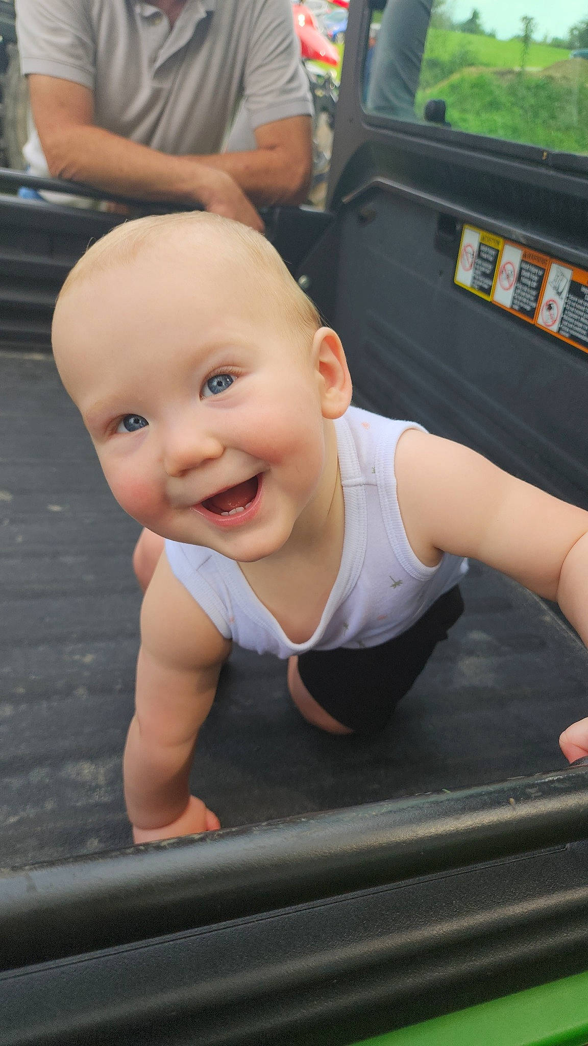 Grayson is registered to the contest to win money with this photo: baby, baby_toddler_clothing, blond, cheek, chest, child, finger, flooring, fun, grass, happy, joint, joy, leisure, person, recreation, sitting, skin, smile, thigh