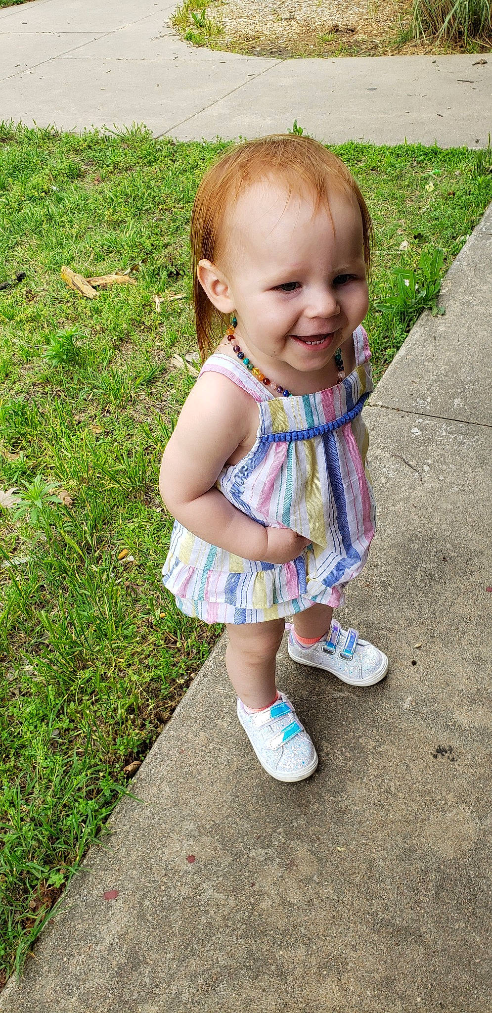 Alessa is registered to the contest to win money with this photo: baby, baby_toddler_clothing, child, dress, grass, joy, pattern, person, plant, play, shoe, skin, smile, summer, toddler