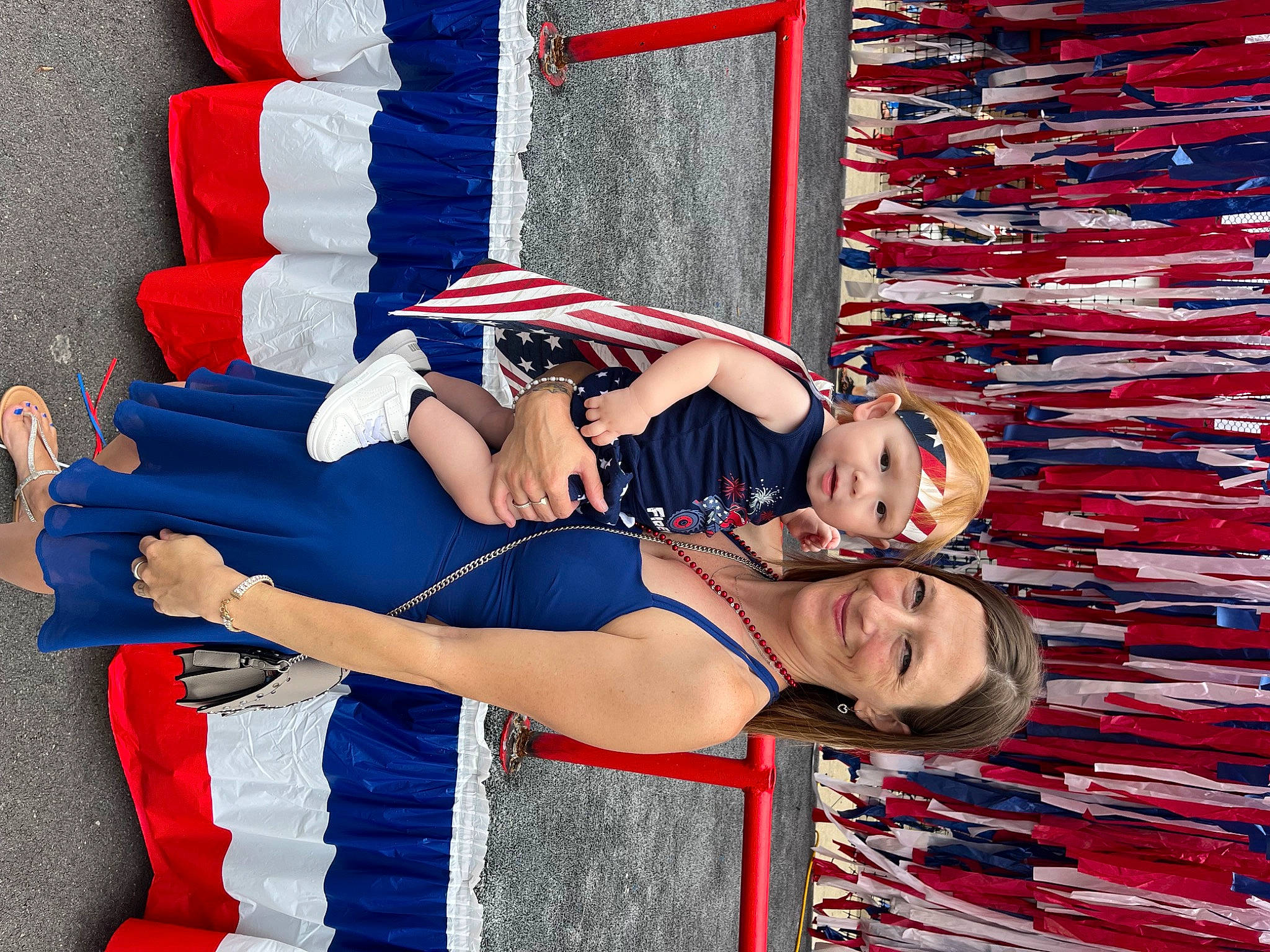 Kendan is registered to the contest to win money with this photo: arm, blue, carmine, dress, electric_blue, event, fashion_design, flag_of_the_united_states, fun, gesture, happy, hat, headwear, human_leg, joy, pattern, person, red, smile, textile