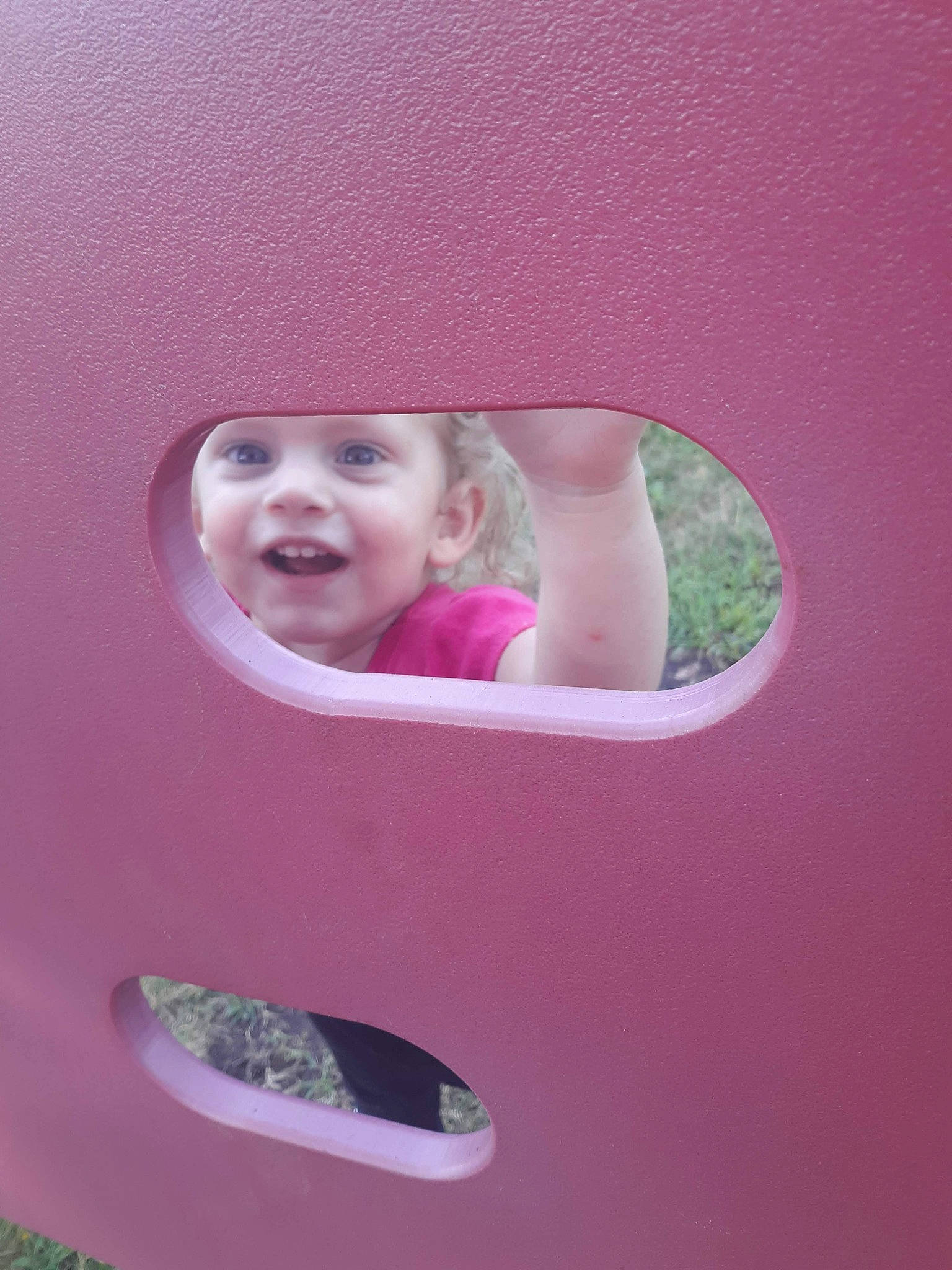 Skyla joined the competition — help win amazing prizes! baby_laughing, baby_toddler_clothing, child, chin, circle, facial_expression, fun, happy, headwear, magenta, material_property, oval, person, pink, play, playground, purple, room, smile, toddler