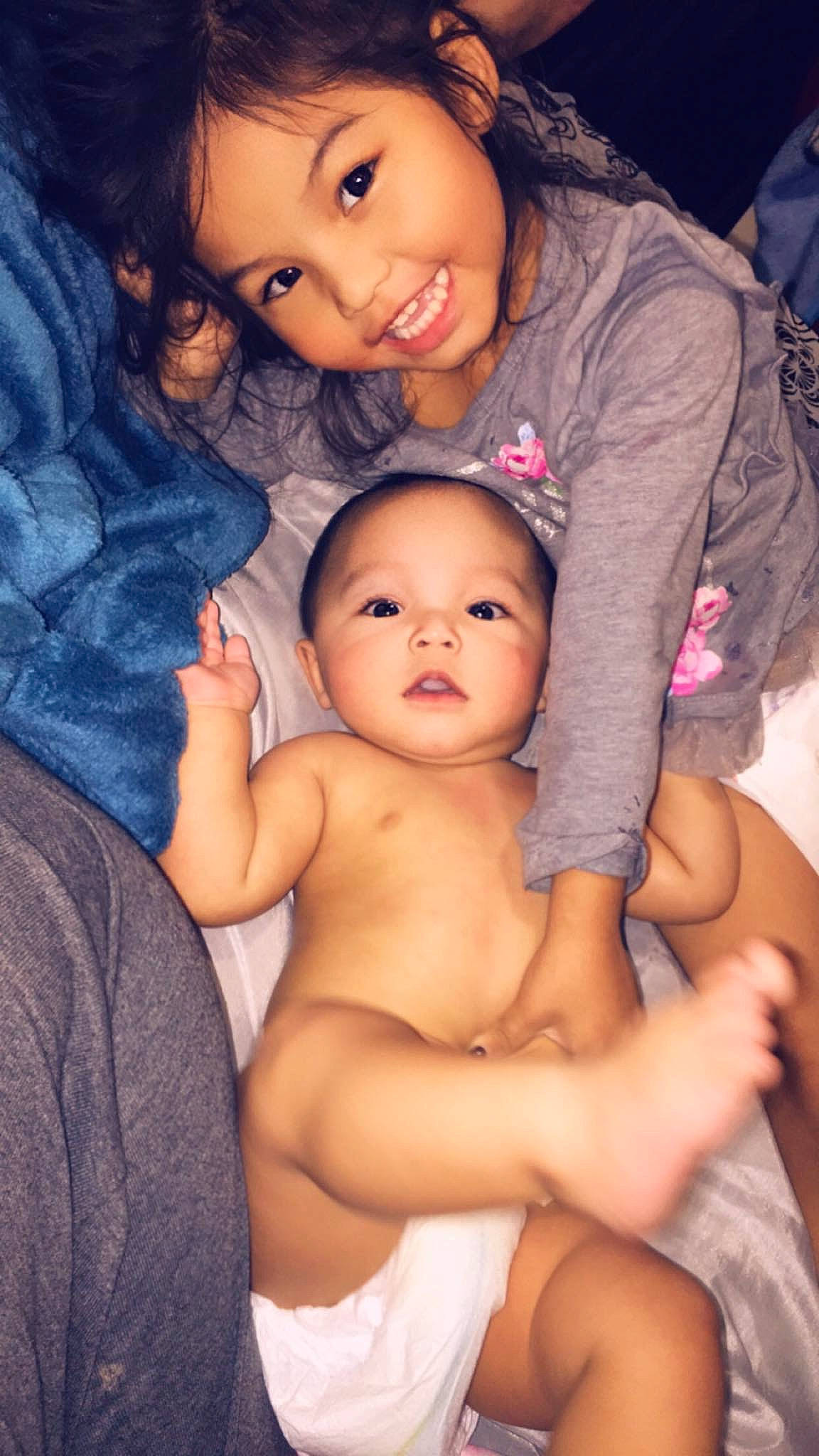 Manolo is registered to the contest to win money with this photo: abdomen, baby, black_hair, cheek, chest, child, daughter, fun, happy, human, joy, mother, people, person, photography, skin, smile, toddler, trunk