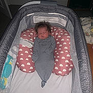 Braylee joined the competition — help win amazing prizes! newborn, baby, infant, sleeping, bassinet, crib, striped_outfit, bedhead, pink_bedding, blanket, nursery, indoor, portrait, resting, closed_eyes, face, infant_bedding, mesh, cozy, photograph