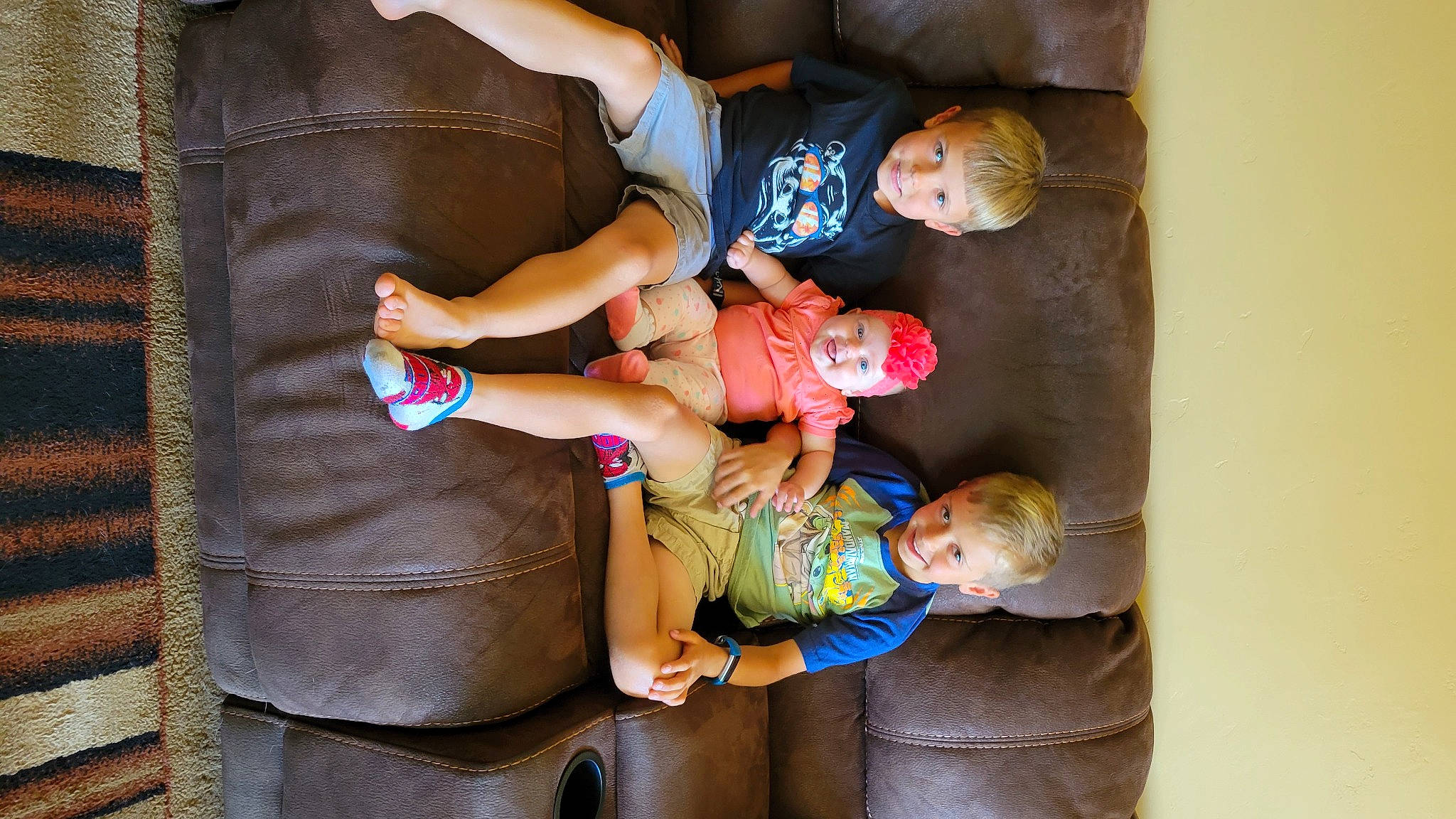 Evelyn is registered to the contest to win money with this photo: abdomen, arm, baby, baby_products, baby_toddler_clothing, child, comfort, happy, headwear, human_leg, joy, lap, leg, leisure, person, plant, shorts, smile, thigh, toddler