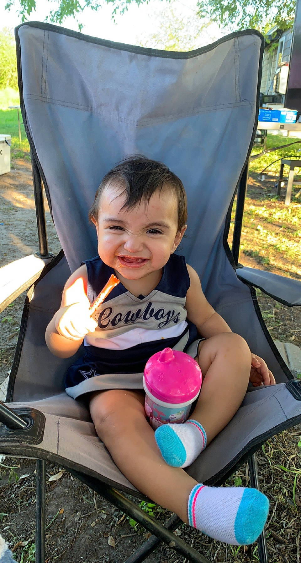 Rosalee joined the competition — help win amazing prizes! chair, child, facial_expression, finger, fun, grass, happy, joy, lap, leisure, people, person, plant, product, recreation, shorts, sitting, skin, smile, summer