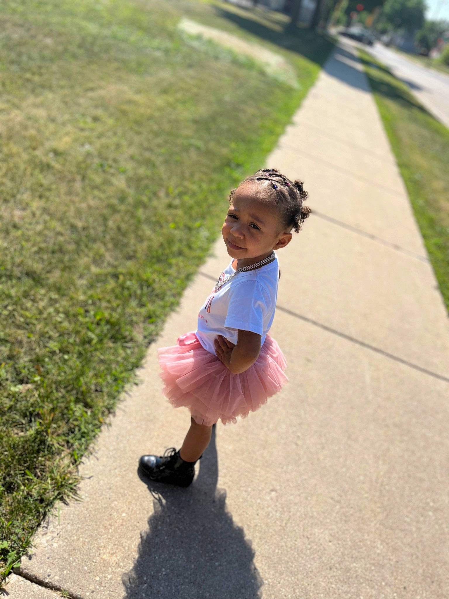 Lilionnie is registered to the contest to win money with this photo: asphalt, child, dress, fun, grass, grass_family, happy, human_leg, lawn, leisure, people_in_nature, person, plant, recreation, road, road_surface, sandal, sidewalk, toddler, tree