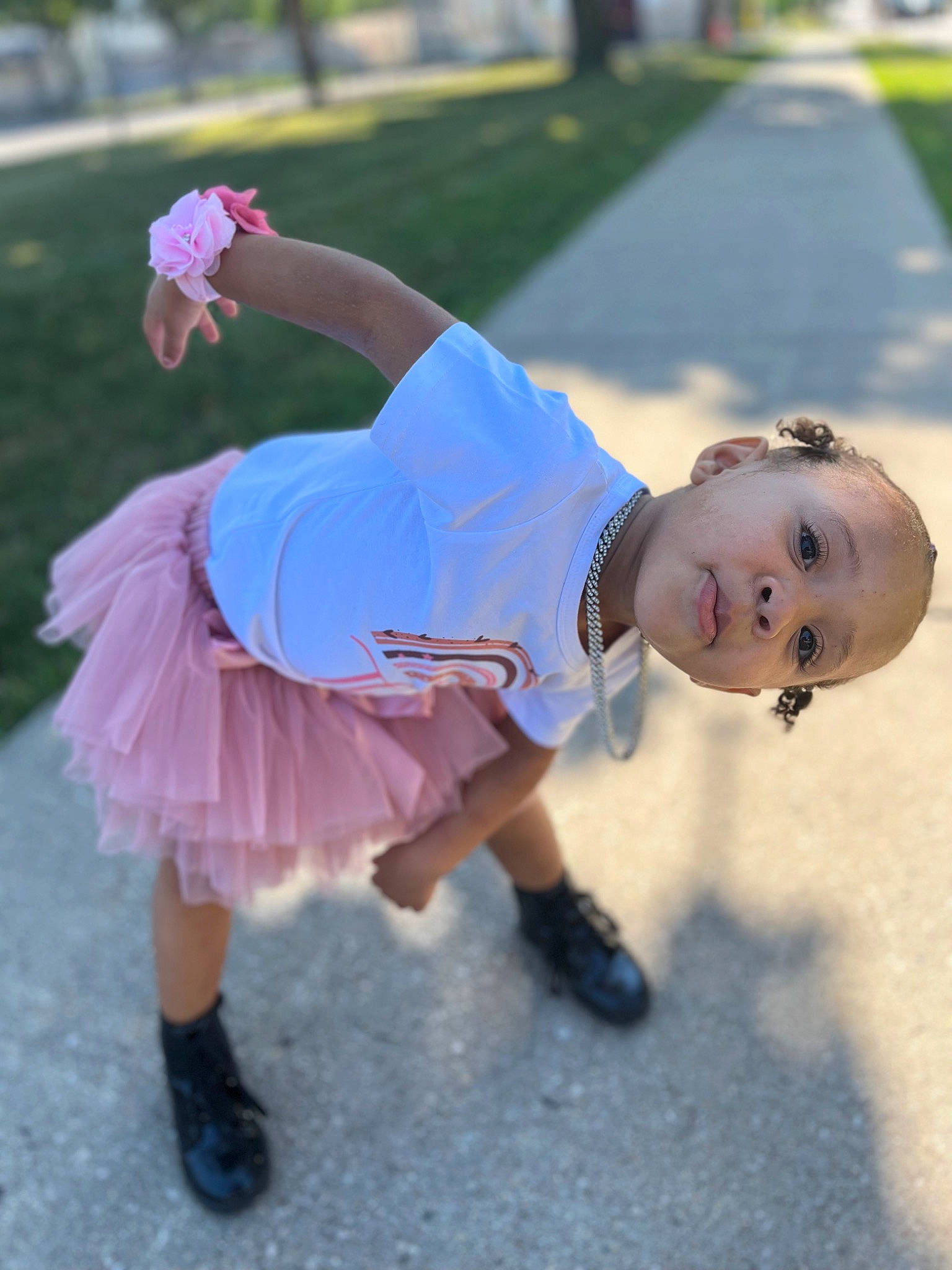 Lilionnie is registered to the contest to win money with this photo: baby, ballet_tutu, child, electric_blue, event, footwear, fun, grass, happy, human_leg, leg, leisure, person, plant, recreation, sandal, shoe, sneakers, t_shirt, toddler
