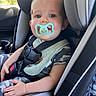 Caden joined the competition — help win amazing prizes! baby, child, infant, car_seat, car, pacifier,  안전, harness, seatbelt, smiling, portrait, indoors, vehicle, camouflage, clothing, sitting, face, eyes, daylight, family
