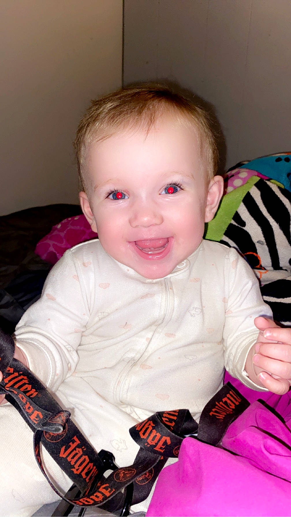 Eliana is registered to the contest to win money with this photo: baby, baby_products, baby_toddler_clothing, carmine, cheek, child, comfort, eye, face, fun, happy, head, iris, joy, person, pink, sitting, skin, sleeve, smile