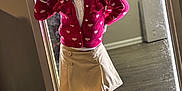 Legend is registered to the contest to win money with this photo: child, girl, smiling, peace_sign, mirror, pink_cardigan, heart_pattern, beige_skirt, sparkly_shoes, pink_shoes, hair_bows, pigtails, indoor, wooden_floor, reflection, happy, fashion, portrait, cute, playful