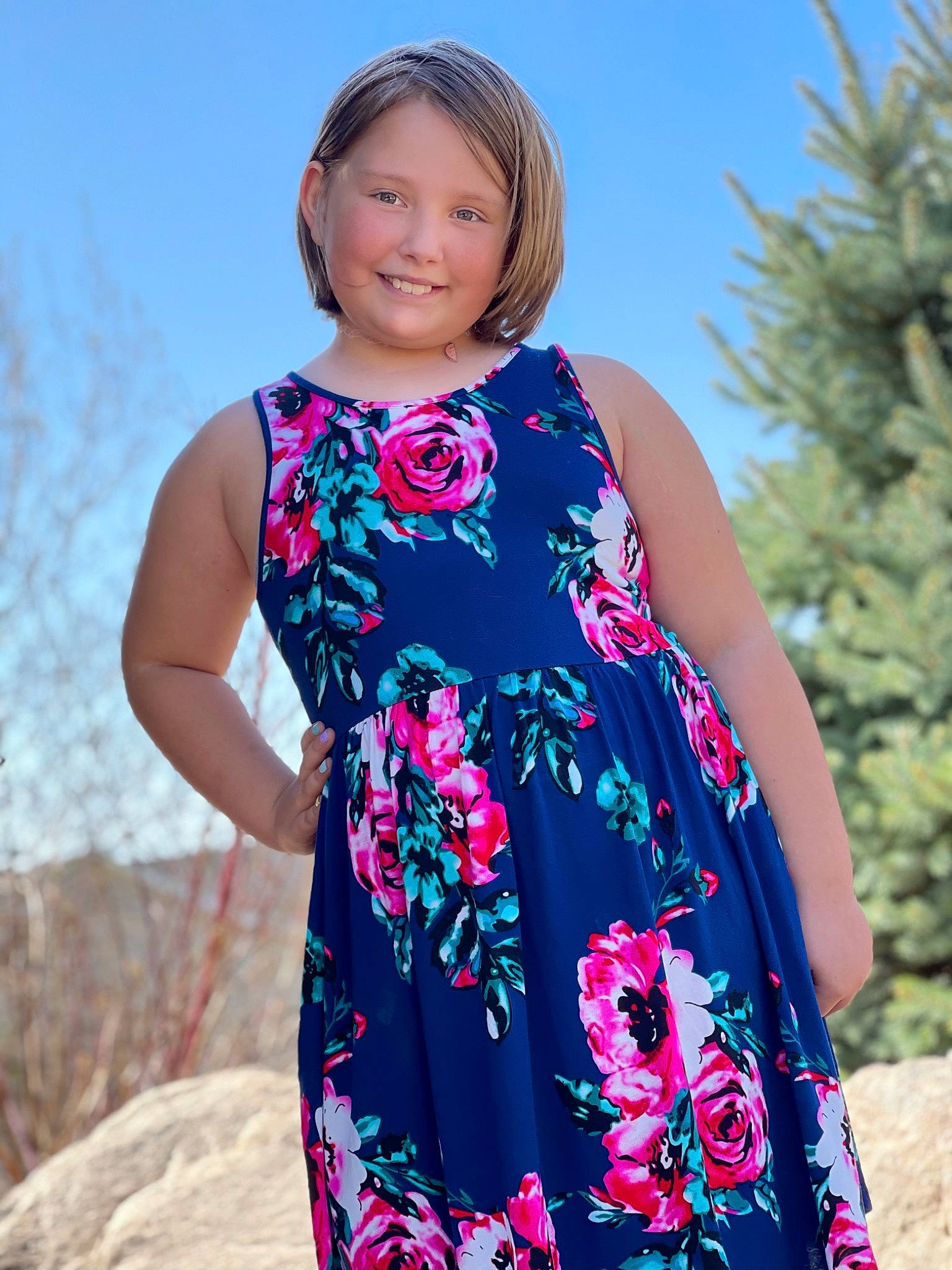 Coco is registered to the contest to win money with this photo: arm, azure, day_dress, dress, gown, hair, hairstyle, happy, joint, joy, neck, one_piece_garment, person, pink, plant, shoulder, sky, sleeve, smile, street_fashion