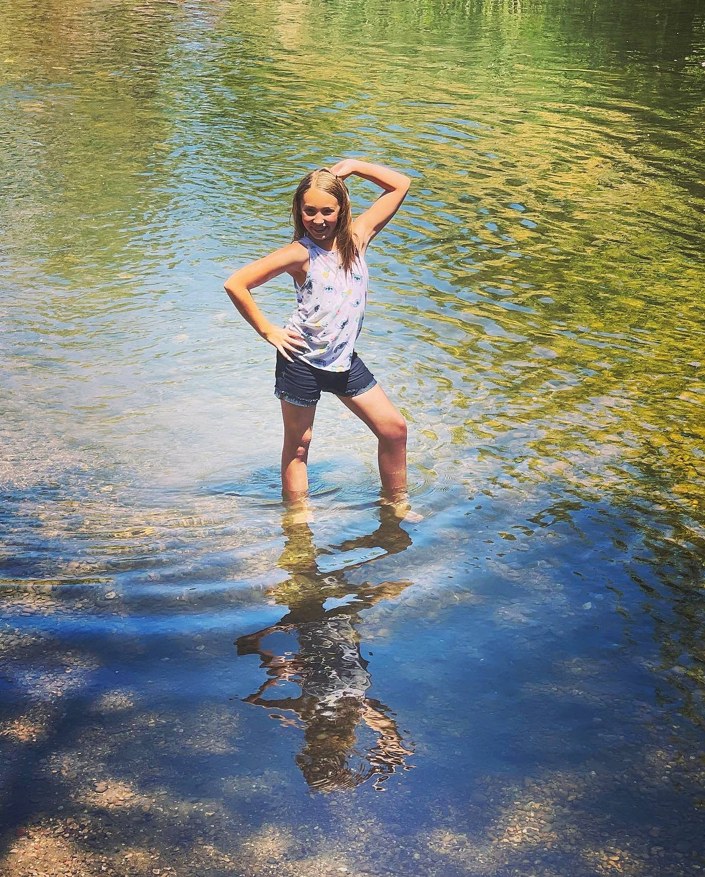 Julliana joined the competition — help win amazing prizes! bank, barefoot, clothing, flash_photography, gesture, hair, hand, happy, human_body, joy, lake, leisure, people_in_nature, person, plant, shorts, summer, sunlight, tree, water