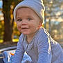 Isaac joined the competition — help win amazing prizes! baby, child, infant, smiling, crawling, hat, knit_hat, striped_clothing, onesie, outdoor, sunlight, golden_hour, portrait, face, hands, nature, blurred_background, happy, cute, young