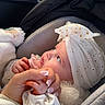 baby, bodypart, bonnet, car, car_interior, carseat, clothing, cushion, face, finger, hand, hat, head, homedecor, newborn, person, photography, portrait, transportation, vehicle