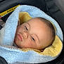 Soeïny participe au concours pour gagner de l'argent avec cette photo : baby, blanket, car_seat, child, face, infant, soft_texture, yellow, blue, wrapped, seatbelt, airbag_warning, clothing, indoors, portrait, young_child, cute, comfort, closeup, resting
