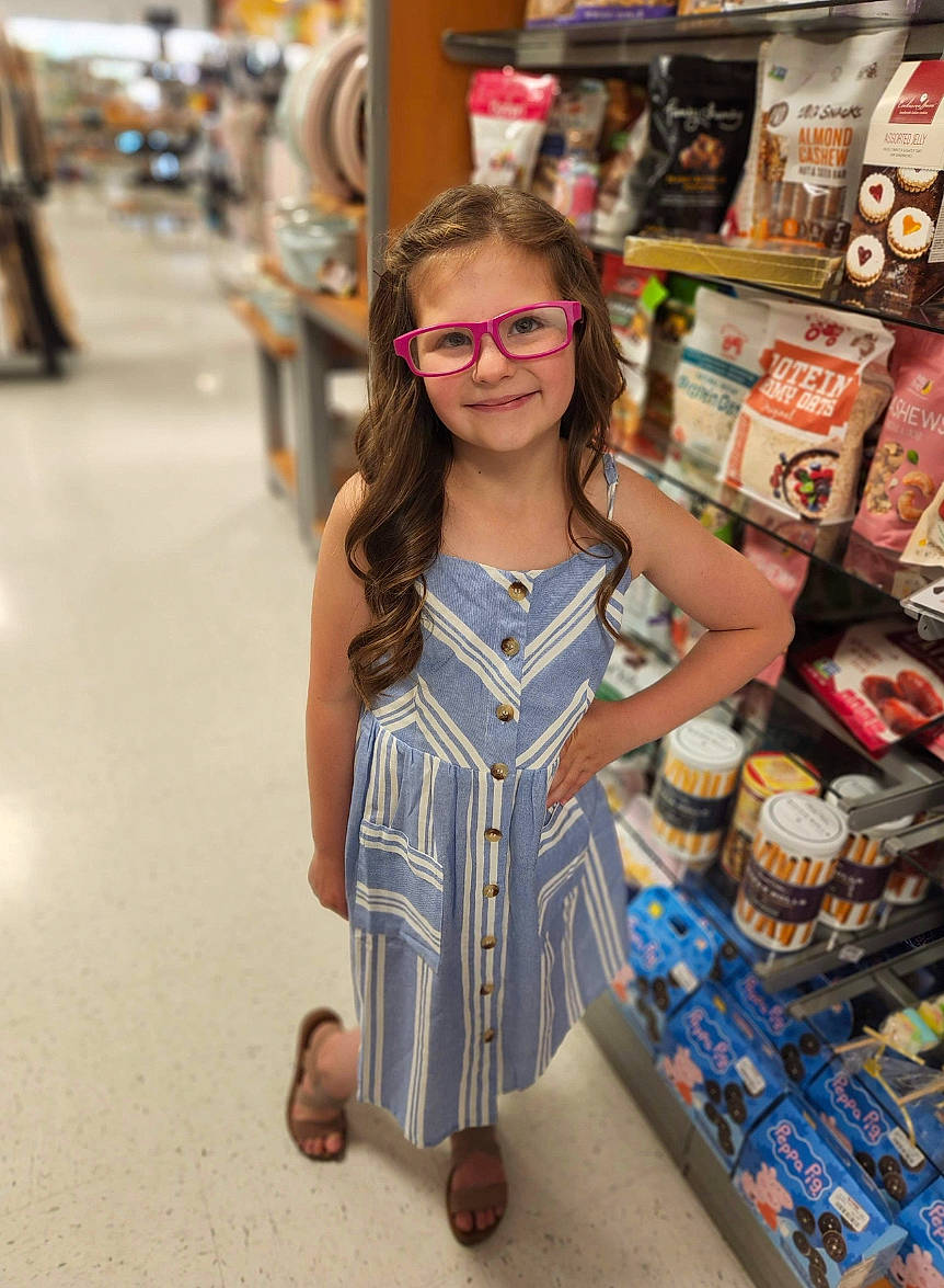 Katherine joined the competition — help win amazing prizes! bag, child, city, convenience_store, customer, dress, event, eyewear, fashion, fun, happy, joy, person, public_space, retail, shelf, shopping, smile, standing, t_shirt