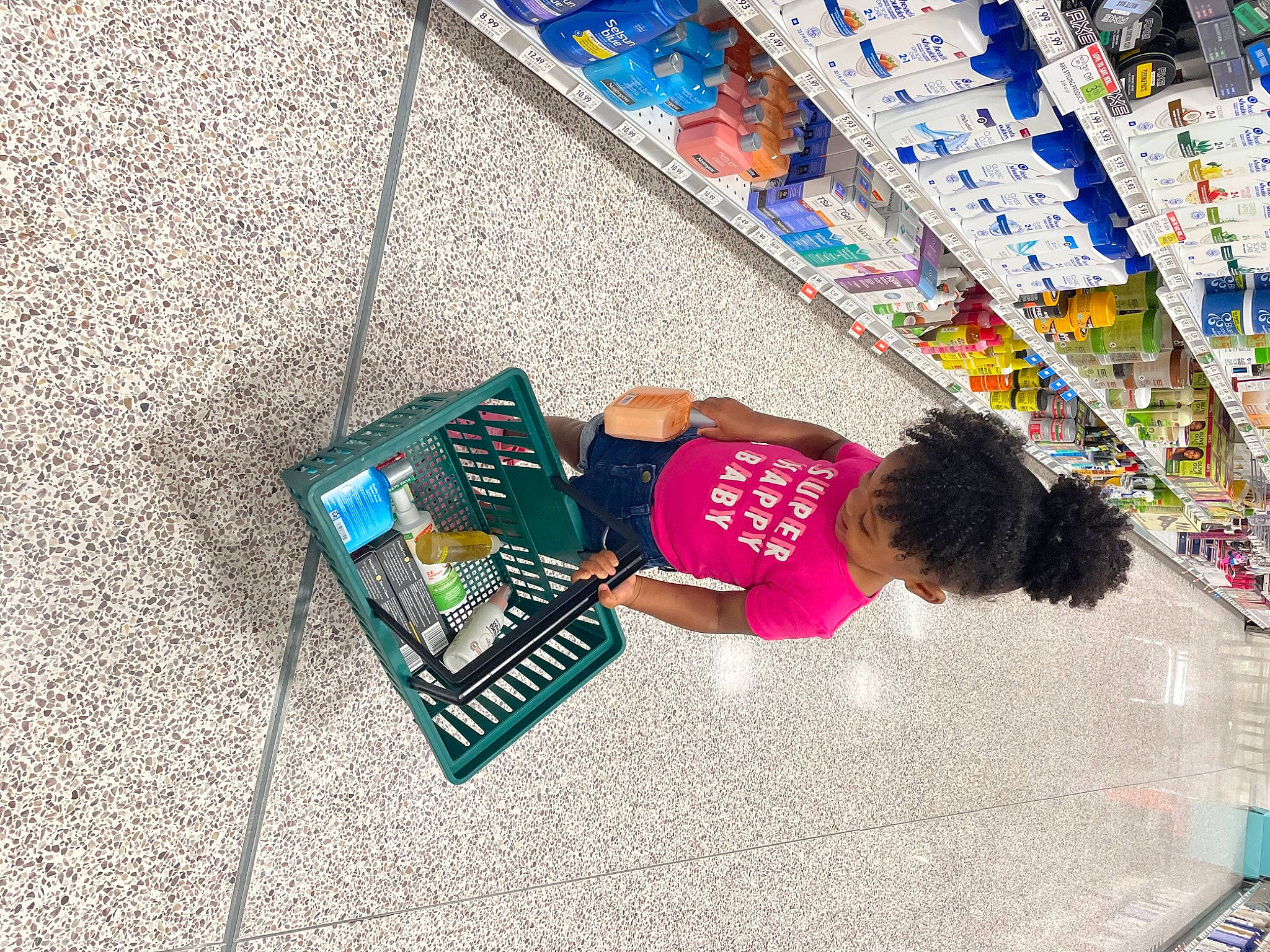 J'Laiya joined the competition — help win amazing prizes! building, child, convenience_store, customer, flooring, font, foot, human_leg, leisure, magenta, pattern, person, play, retail, shelf, shopping, shopping_cart, sidewalk, t_shirt, thigh