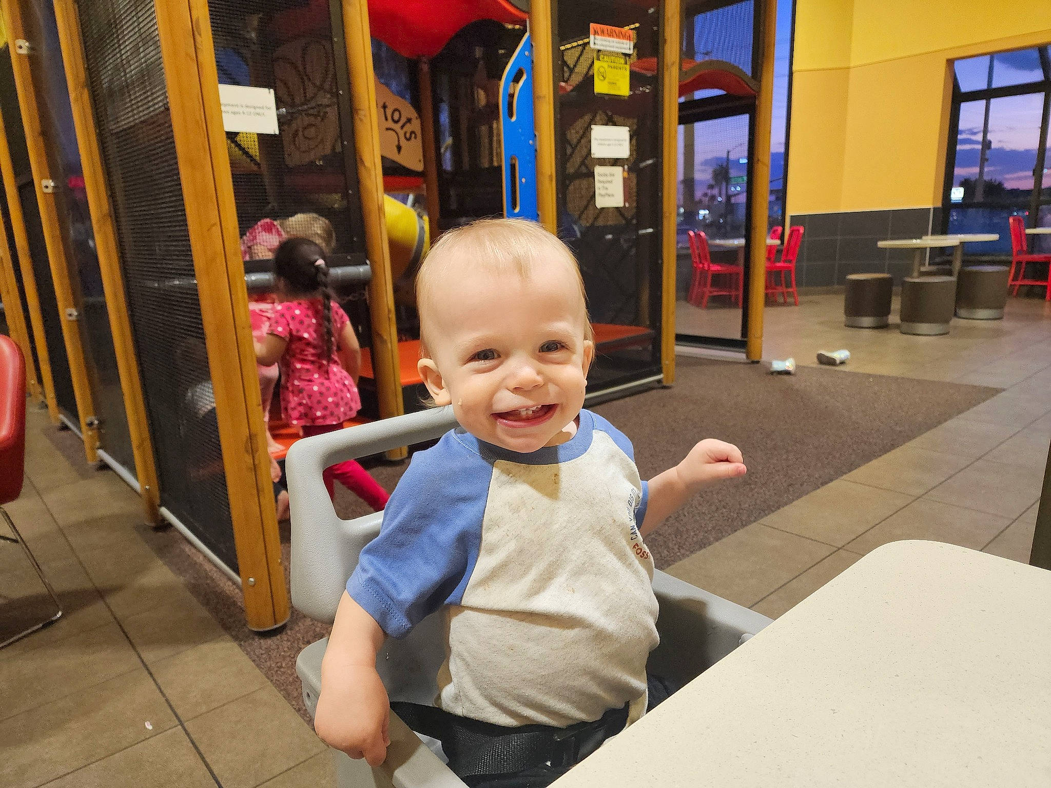 Walker joined the competition — help win amazing prizes! baby, chair, child, city, door, flooring, fun, happy, joy, leisure, person, play, recreation, room, sitting, smile, standing, t_shirt, toddler, vacation