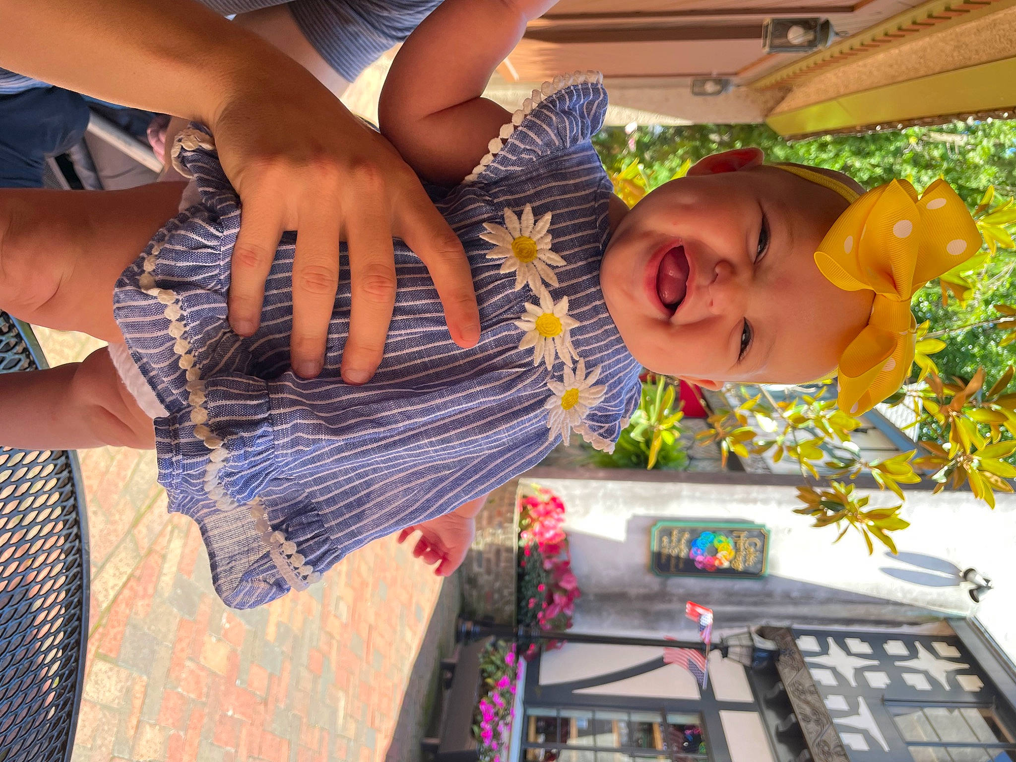 Analia is registered to the contest to win money with this photo: calf, child, clothing, eyewear, fun, happy, headwear, human_leg, leisure, pattern, person, plaid, plant, play, recreation, sitting, smile, toddler, tree, vacation
