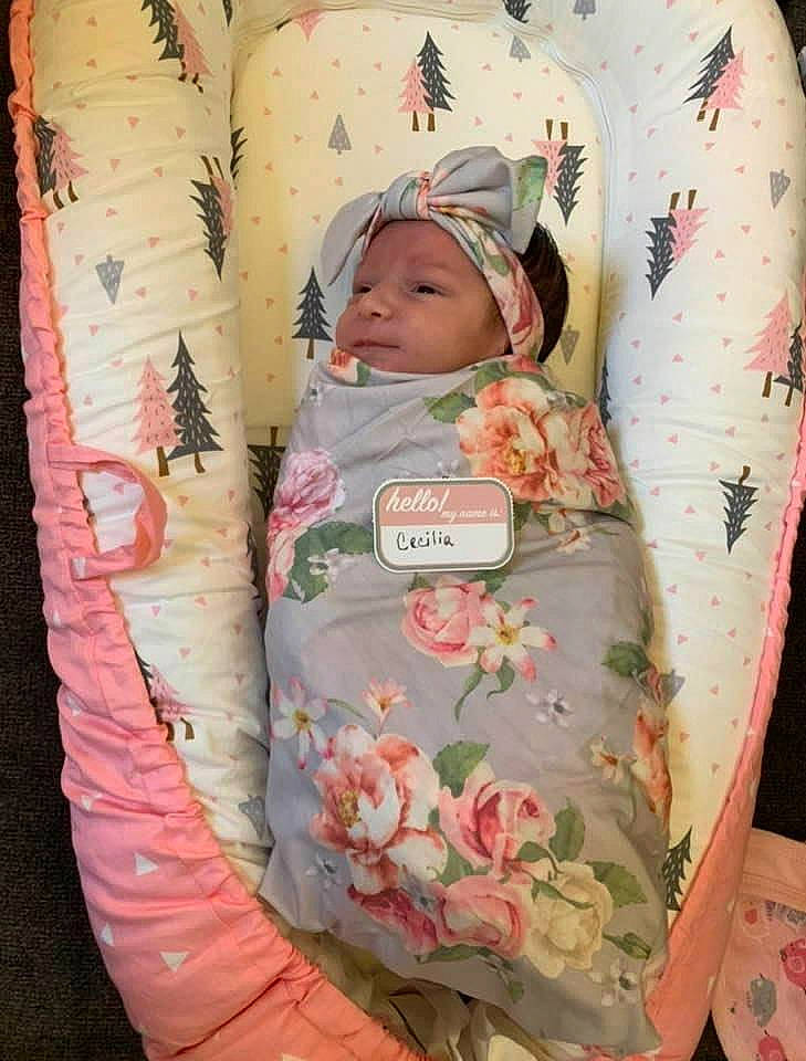 Cecilia is registered to the contest to win money with this photo: baby, baby_products, baby_safety, baby_sleeping, baby_toddler_clothing, bedding, cheek, child, comfort, flower, headwear, infant_bed, linens, pattern, peach, person, pink, room, skin, sleeve