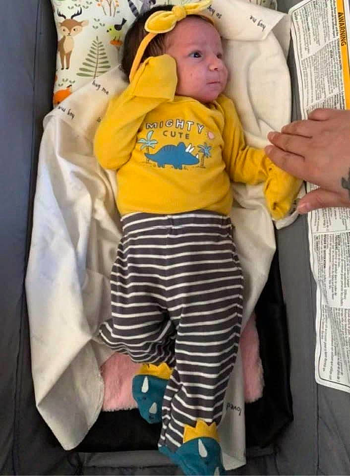 Cecilia joined the competition — help win amazing prizes! baby, baby_products, baby_safety, baby_sleeping, baby_toddler_clothing, child, comfort, fun, gesture, knee, person, personal_protective_equipment, room, sitting, sleeve, t_shirt, thigh, thumb, toddler, white